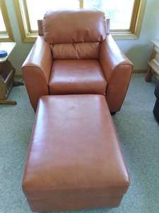 lot 29 image: Durablend Blissfully Burnt Orange Leather Padded Arm Chair and Ottoman 