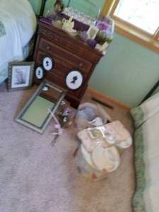 lot 42 image: Eclectic Collection of Decor Silver Toned Mirror, Nesting Boxes, Faux Flowers, and More