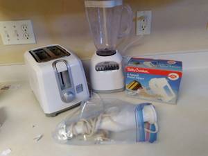 lot 64 image: White Black and Decker Toaster, Oster Blender, Betty Crocker Mixer, Rival Hand Mixer