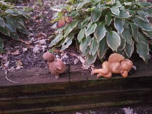 lot 112 image: Adorable Ornamental Garden Decor Squirrel, Cherub, Butterfly, Etc. 