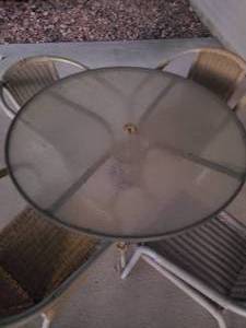 lot 113 image: Excellent 48 Glass Top Round Outdoor Table with (4) Matching Wicker Rattan Style Chairs