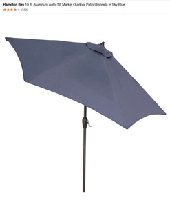 lot 31 image: Westin Outdoor 4-Piece Universal Umbrella Base (Black) & Hampton Bay 10 ft. Aluminum Auto-Tilt Market Outdoor Patio Umbrella in Sky Blue. See Pictures