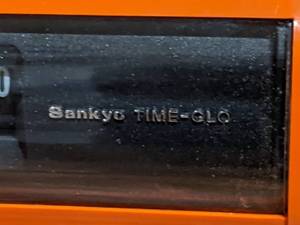 lot 67 image: MOD Orange Sanyo Time-Glo Flip-Number Clock