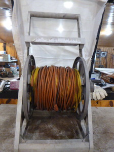 lot 104 image: Extension Cords on Hose Reel