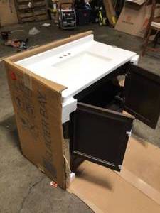 lot 23 image: Glacier Bay Vanity and Top damaged on one side customer return  See Pictures
