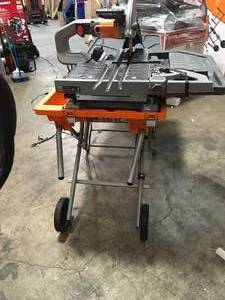 lot 1 image: RIDGID 10 in. Wet Tile Saw with St10 in. Wet Tile Saw with Stand  IN WORKING CONDITIONS