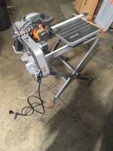 lot 3 image: RIDGID 12 Amp Corded 8 in. Tile Saw  motor work missing parts see the pics