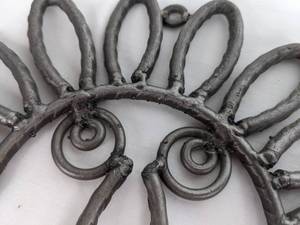 lot 305 image: Two Metal Sculpture Face Hooks Made in Honduras