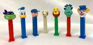 lot 227 image: Seven Vintage Pez Dispensers