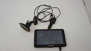 lot 8 image: Garmin GPS---Window Or Dash Mount---IT WORKS BUT WILL NEED UPDATE