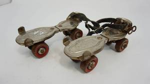 lot 15 image: A Pair Of Vintage Globe Strap On Roller Skates