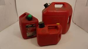 lot 21 image: Three Red Gas Cans--Different Sizes--5 Gallon & 2 Gallon & 1Gallon
