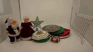 lot 25 image: Christmas Tins & Trays- Wire Microwave Shelf-Green Glittery Tree Top-Candle Holder-Mr & Mrs Standing Santas