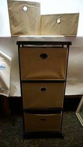 lot 55 image: Three Drawer Tan Fabric Storage Unit In A Black Framed Cart On Casters