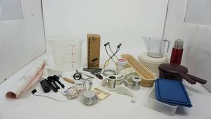 lot 91 image: Miscellaneous Tupperware-Wooden Bread Tray-Roll Of Contact Paper-Drink Cup-Pampered Chef One Valtrompia Bread Tube-Baking Cups-Jelly Jar WCover-Miscellaneous Spoons-Secure-Grip Lifter-Cheese Grater
