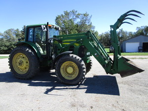 lot 1 image: 2010 John Deere 7330 Premium Tractor w741 Self Leveling Loader
