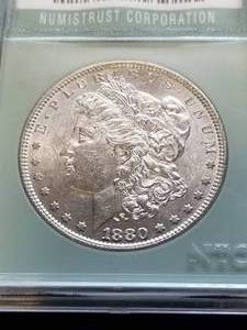 lot 21 image: 1880-O MORGAN SILVER DOLLAR MS62 NTC