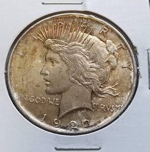 lot 32 image: 1922 PEACE SILVER DOLLAR AU TONED (LOOKS BETTER IN HAND)