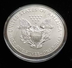 lot 34 image: 2014 AMERICAN SILVER EAGLE 1 TROY OZ .999 FINE SILVER IN AIRTITE