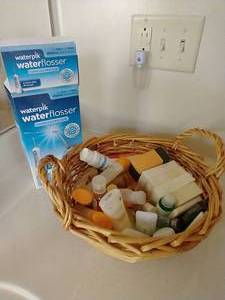 lot 84 image: Waterpik & Basket of Toiletries