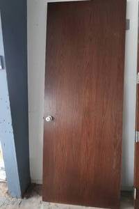 SOLID WOOD DOOR WITH HARDWARE.