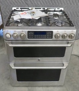STAINLESS GE SELF CLEANING CONVECTION DOUBLE OVEN GAS RANGE.