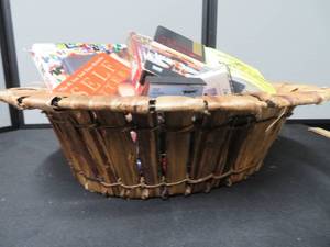 COOL BASKET OF BOOKS AND KNITTED THROW.