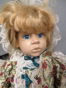 VINTAGE DOLL AND WOODEN BABY CRADLE.