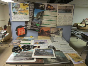 lot 211 image: VINTAGE TRAIN POSTERS, CALENDARS, BLUEPRINTS, HATS, MORE