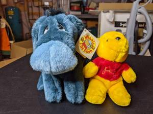 lot 101 image: Rare Vintage Sears Disney Winnie The Pooh and Eeyore Plushes