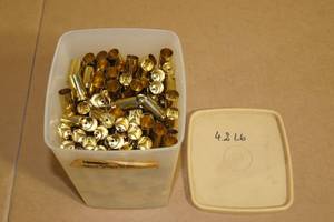 lot 155 image: Container of Empty .45 Auto Casings