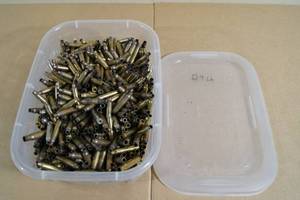 lot 151 image: Bin of Empty .223 Casings