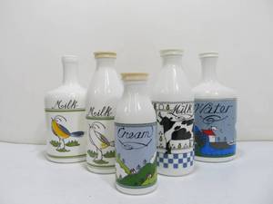 lot 41 image: Vintage Alan Wood Milk Glass Bottles