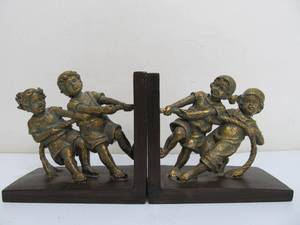 lot 330 image: Kids Playing Tug-O-War Bookends Set