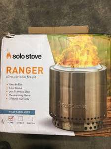 lot 33 image: Ranger Bundle 15 in. x 12.5 in. Round Stainless Steel Wood Burning Portable Fire Pit with Stand Included by Solo Stove Customer Returns See Pictures