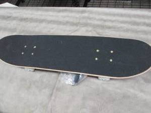 Maple Deck Skateboard with Tool out...
