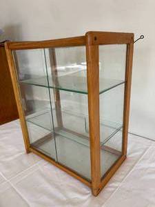 lot 54 image: Contoure Cosmetics  Wood and Glass Display Piece