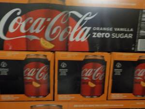 lot 277 image: 4 - 12 packs Coca Cola Orange Vanil...
