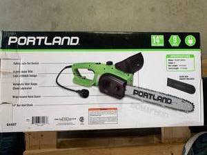 lot 1 image: Like New Portland 9 Amp 14 Electric Chainsaw (Only Used Once)