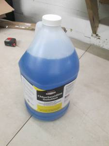 Gallon of cleaner, open box...