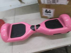 Pink hoverboard, powers on, open bo...