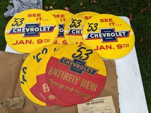 lot 48 image: Set of (8) 53 Chevy Tire Cover Adverts