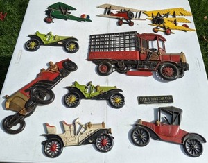 lot 16 image: Lot of (9) Cast Metal Vintage Car Wall Art & Farr Motors Co. Logo