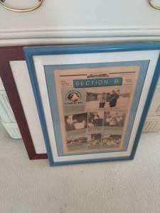 Framed Newspaper And Empty Frame