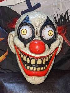 lot 19 image: Hideous or Hillarious  Clown Mask & Window Cling