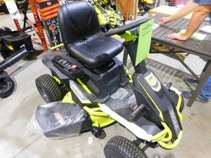 lot 84 image: RYOBI 48V Brushless 38 in. 100 Ah Battery Electric Rear Engine Riding Lawn Mower