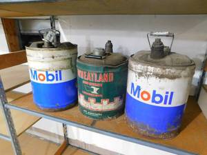 lot 27 image: (3) Vintage 5 Gallon Gas cans.