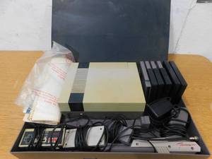 lot 29 image: Nintendo System With Games , Gun, Case