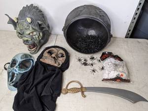 lot 365 image: Lot of (3) Halloween Masks, Plastic Cauldron & SpidersWebs & a Plastic Sword