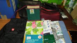 lot 25 image: New in Package Tablecloths and more.